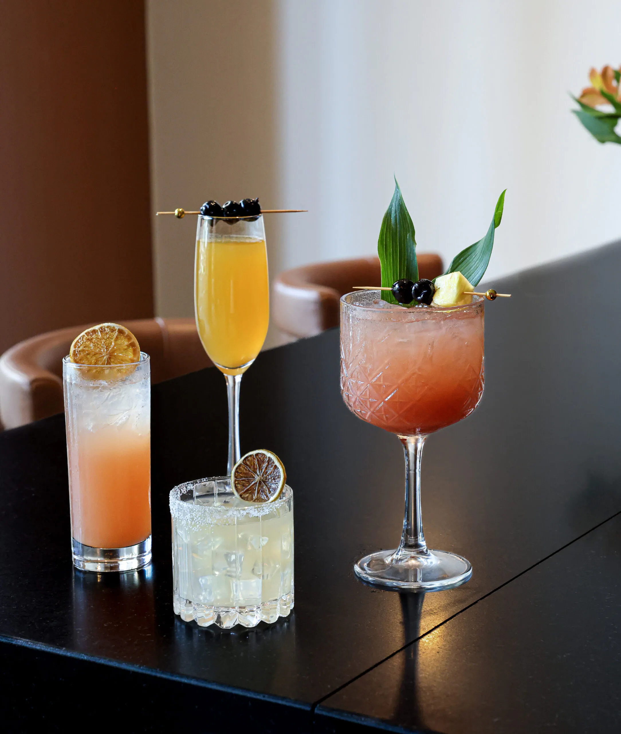 image of four vibrant cocktails on the bar top