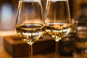 Close up photo of two glasses of white wine