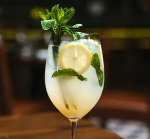 Spritz cocktail with lemon and mint