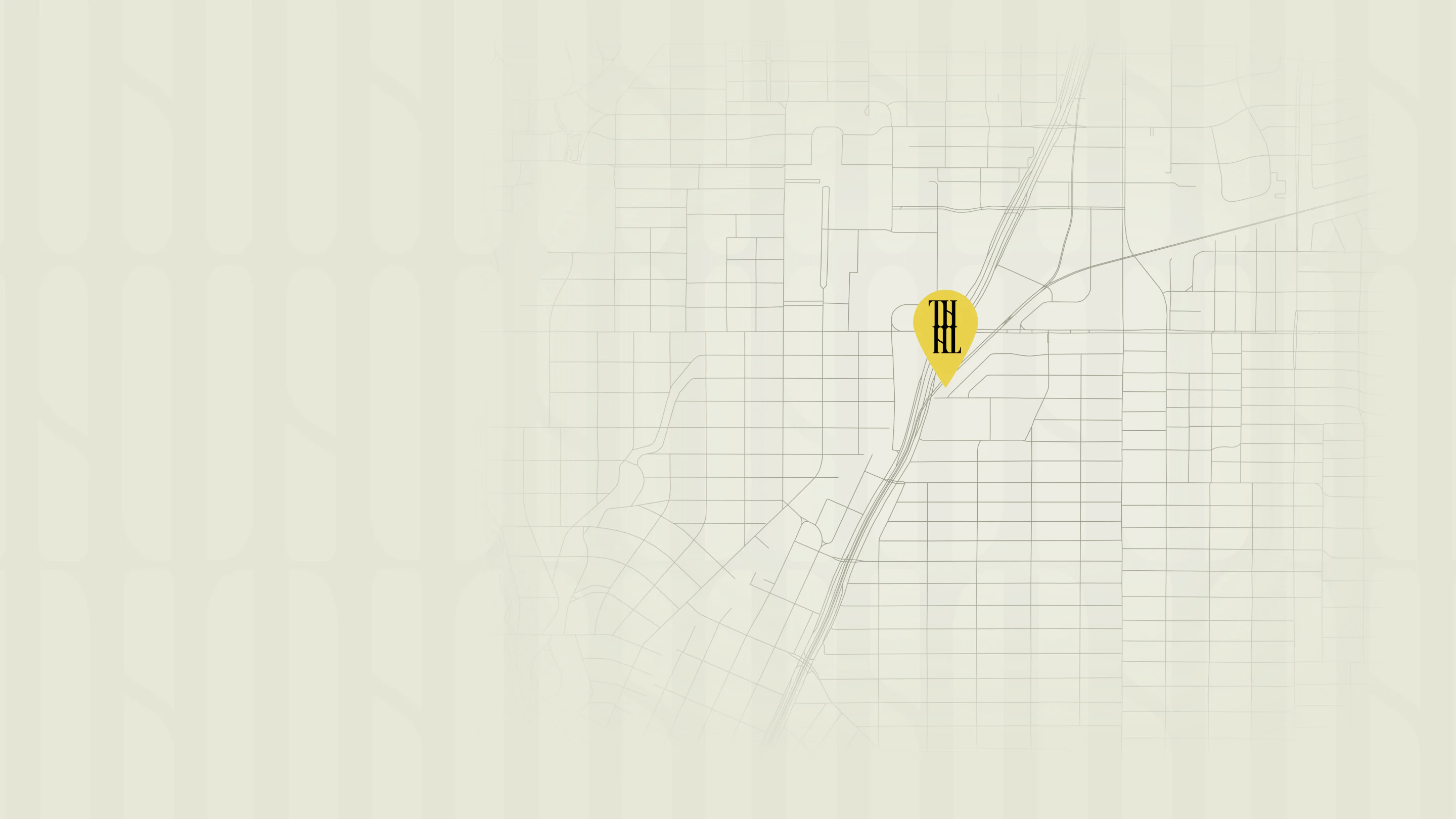 Simple map with a yellow location pin marked TH near the center, highlighting a specific spot on a minimal grid background.